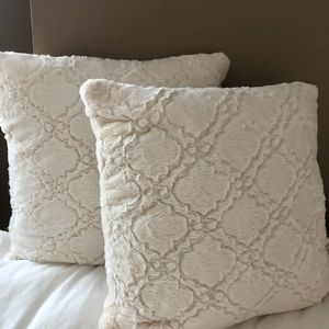 Two Fuzzy Cream Throw Pillows